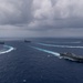 Ronald Reagan and Carl Vinson Carrier Strike Groups steam in formation with Japan Maritime Self-Defense Force (JMSDF) first-in-class helicopter destroyer JS Hyuga (DDH 181) during Multi-Large Deck Exercise