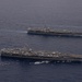 Ronald Reagan and Carl Vinson Carrier Strike Groups steam in formation with Japan Maritime Self-Defense Force (JMSDF) first-in-class helicopter destroyer JS Hyuga (DDH 181) during Multi-Large Deck Exercise