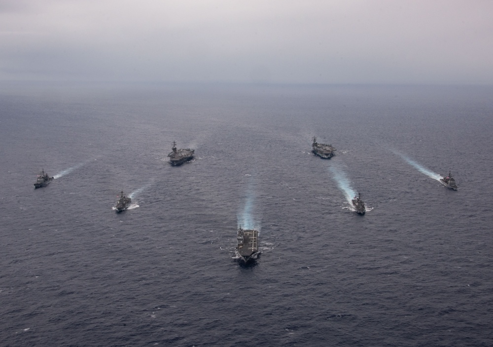 Ronald Reagan and Carl Vinson Carrier Strike Groups steam in formation with Japan Maritime Self-Defense Force (JMSDF) first-in-class helicopter destroyer JS Hyuga (DDH 181) during Multi-Large Deck Exercise