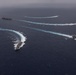 Ronald Reagan and Carl Vinson Carrier Strike Groups steam in formation with Japan Maritime Self-Defense Force (JMSDF) first-in-class helicopter destroyer JS Hyuga (DDH 181) during Multi-Large Deck Exercise