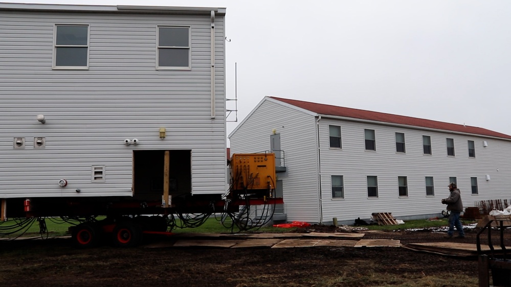 World War II-era barracks rolls to its new foundation at Fort McCoy