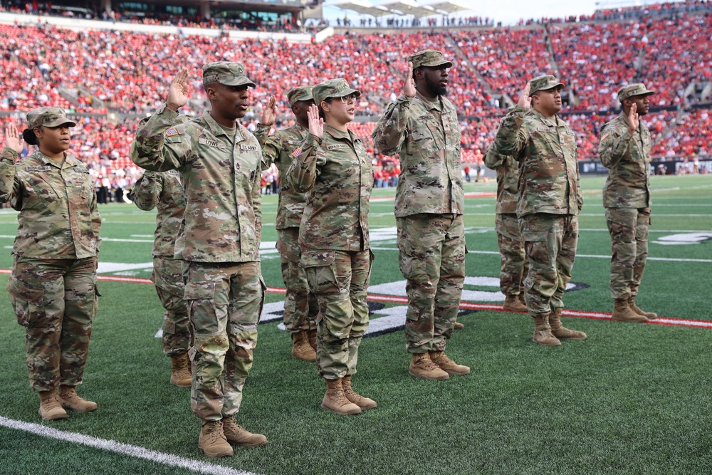 1st TSC Soldiers reenlist during Cardinal football’s ‘Salute to Service’ game