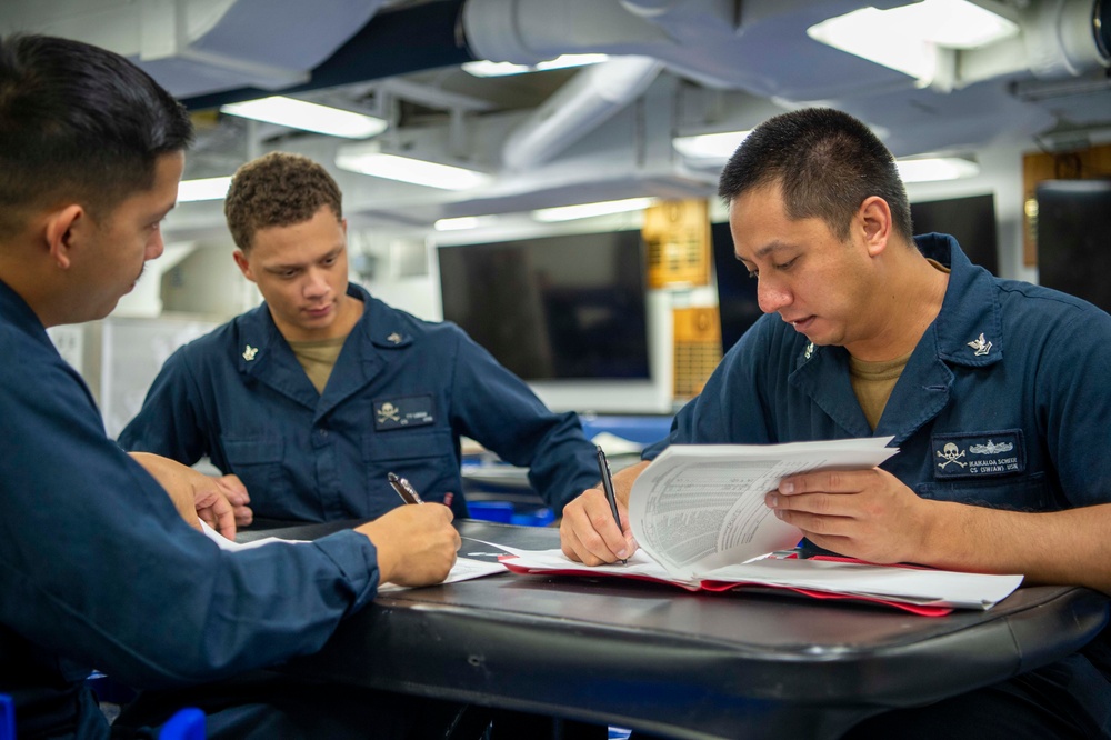 USS Kidd (DDG 100) Sailor Verifies Supply Log