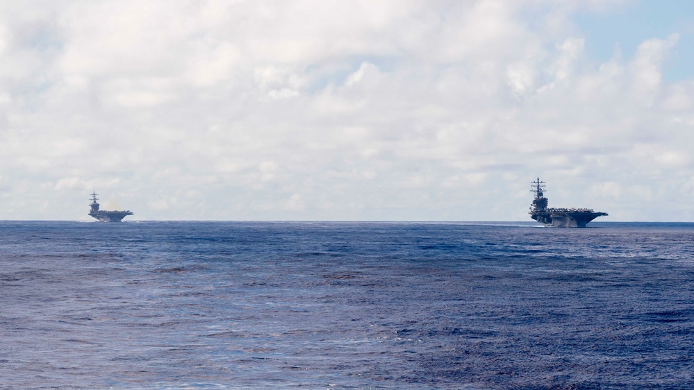 USS Carl Vinson (CVN 70) And USS Ronald Regan (CVN 76) Sail In Formation During Multi-Large Deck Event (MLDE)