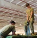 U.S. Army Parachute Riggers lift equipment