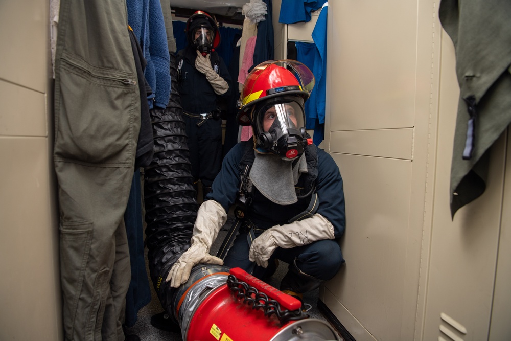 Sailors Use Desmoking Equipment