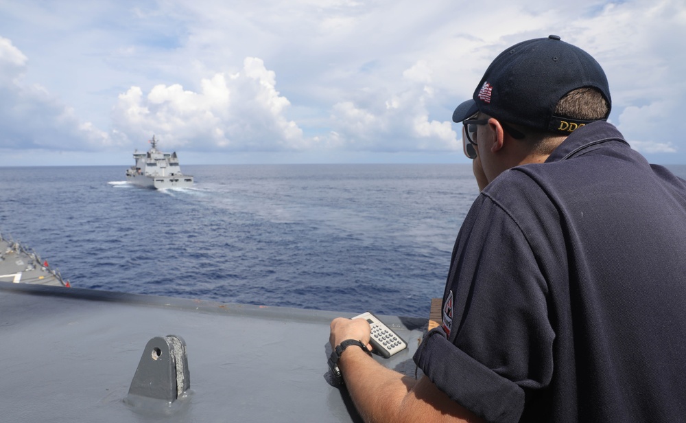 Sailors aboard the USS Rafael Peralta (DDG 115) conduct a replenishment-at-sea with Royal New Zealand Navy auxiliary oiler replenishment ship HMNZS Aotearoa (A 11) in the South China Sea