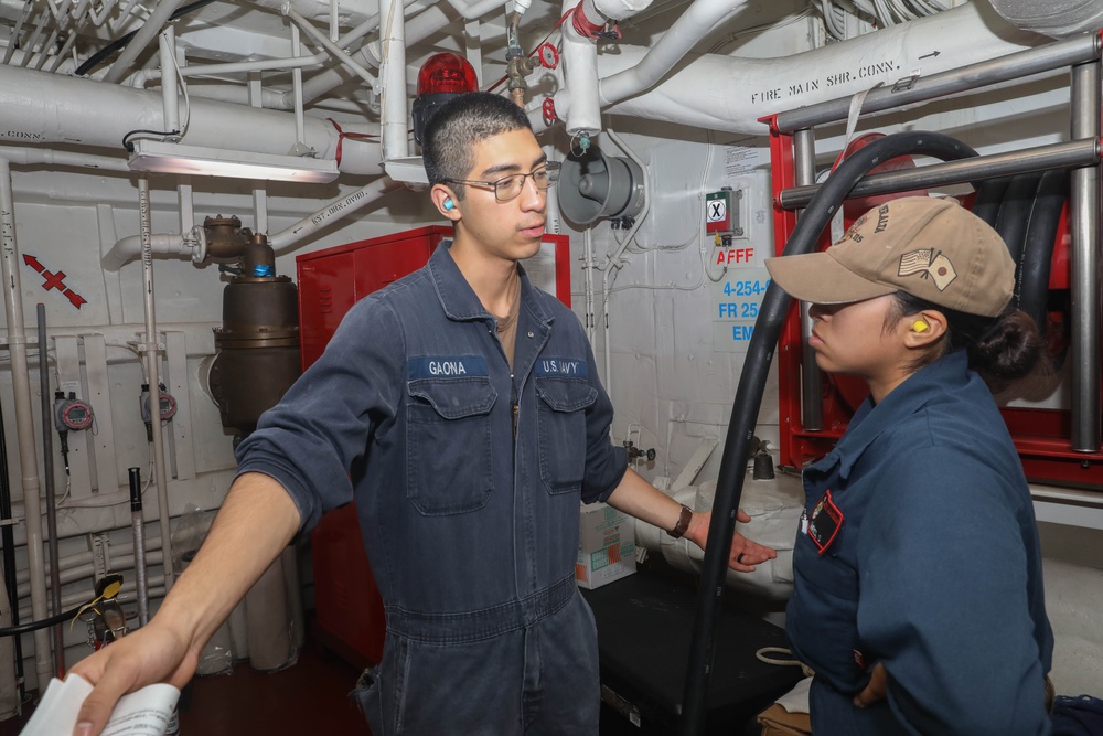 Sailors aboard the USS Rafael Peralta (DDG 115) conduct participate in engineering drills in the South China Sea