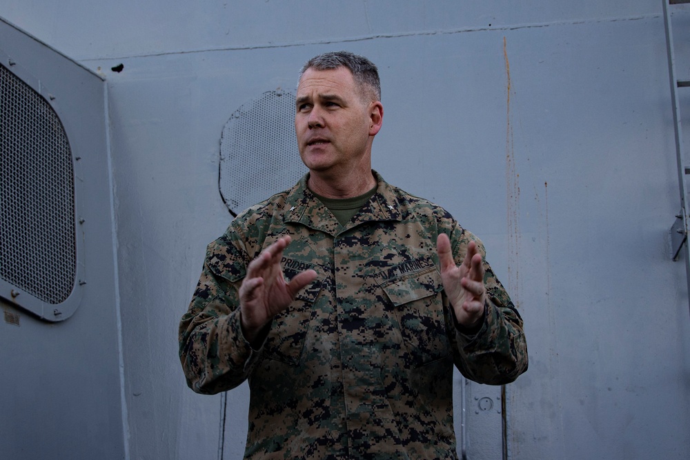 Task Force 61/2 commanding general speaks to troops aboard USS Mesa Verde