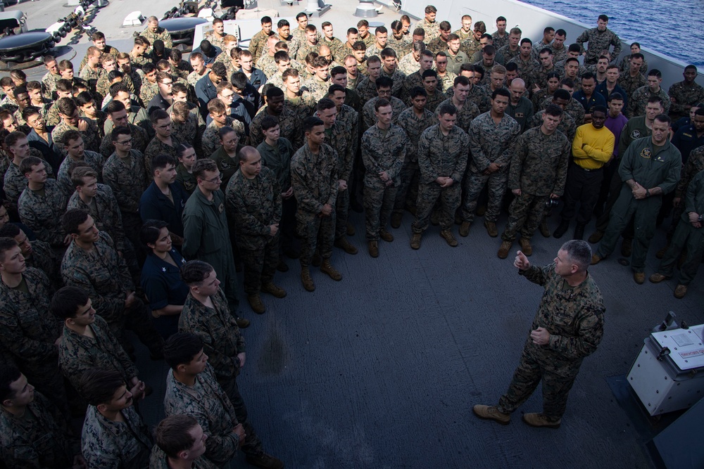 Task Force 61/2 commanding general speaks to troops aboard USS Mesa Verde