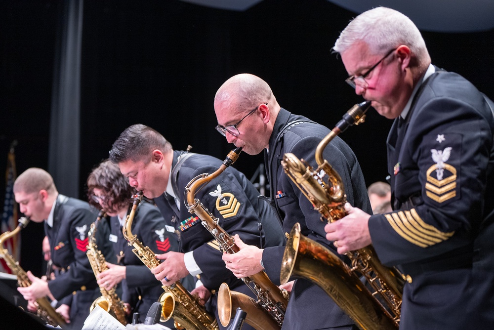 The saxophone section stands up during a swinging soli at Asheboro High School