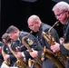 The saxophone section stands up during a swinging soli at Asheboro High School