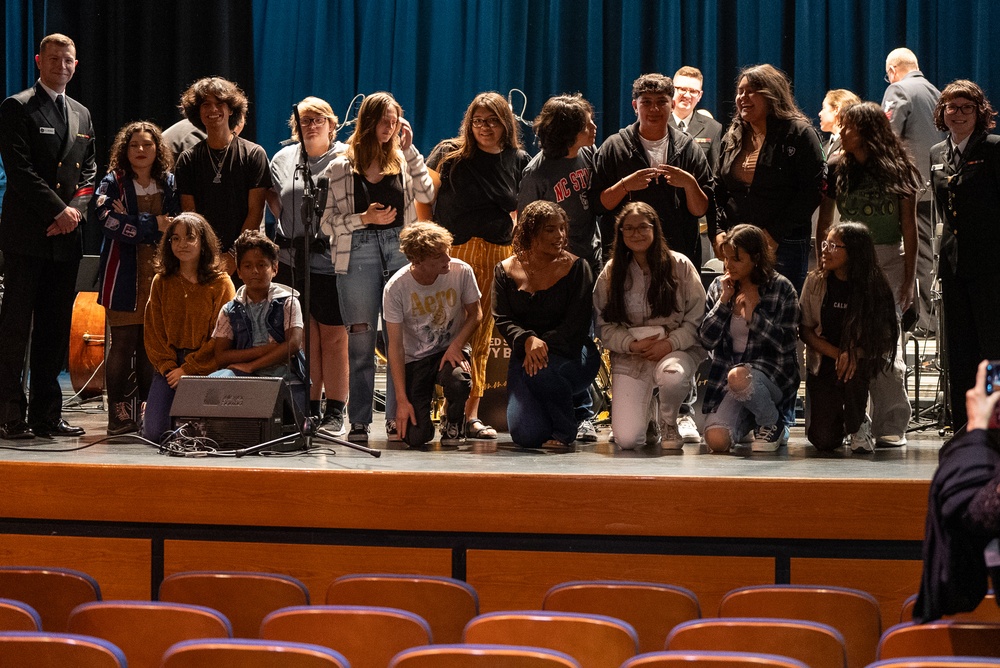 Members of the US Navy Band Commodores pose with students at Asheboro High School