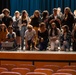 Members of the US Navy Band Commodores pose with students at Asheboro High School