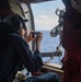 USS Ronald Reagan (CVN 76) Sailors reenlist during a flight in an MH-60S Sea Hawk, attached to Helicopter Sea Combat Squadron (HSC) 12