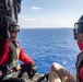 USS Ronald Reagan (CVN 76) Sailors reenlist during a flight in an MH-60S Sea Hawk, attached to Helicopter Sea Combat Squadron (HSC) 12