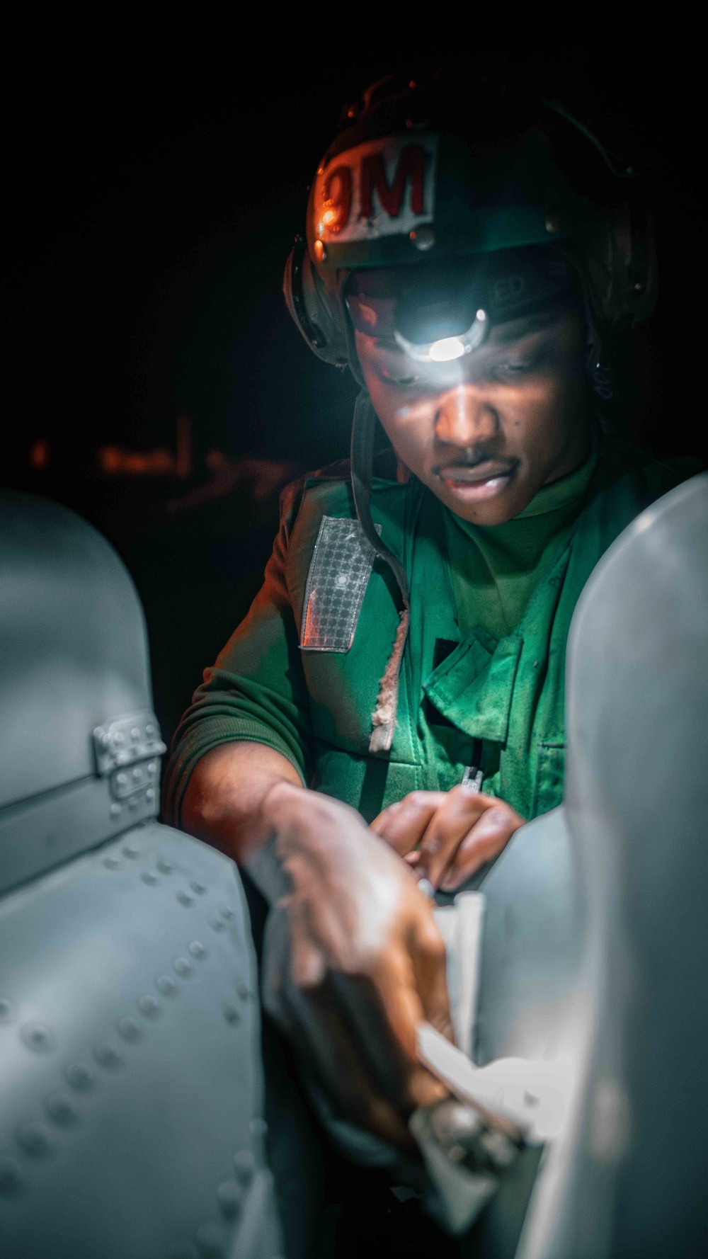 Sailor cleans MH-60S Sea Hawk aboard USS Carl Vinson