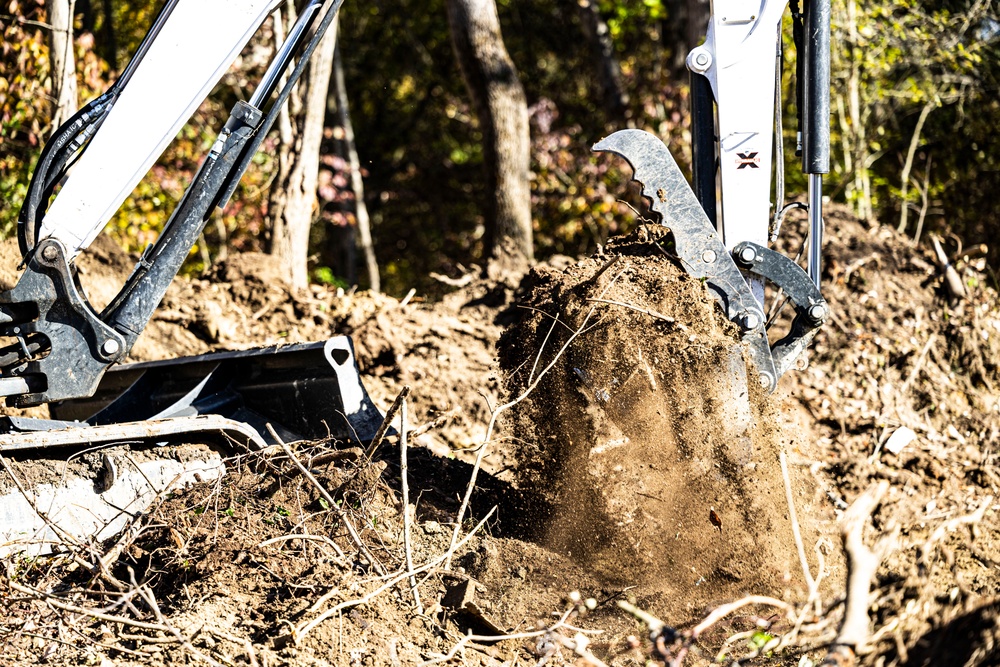 USACE Shenango Maintenance Mechanic clears brush to expand campsites.