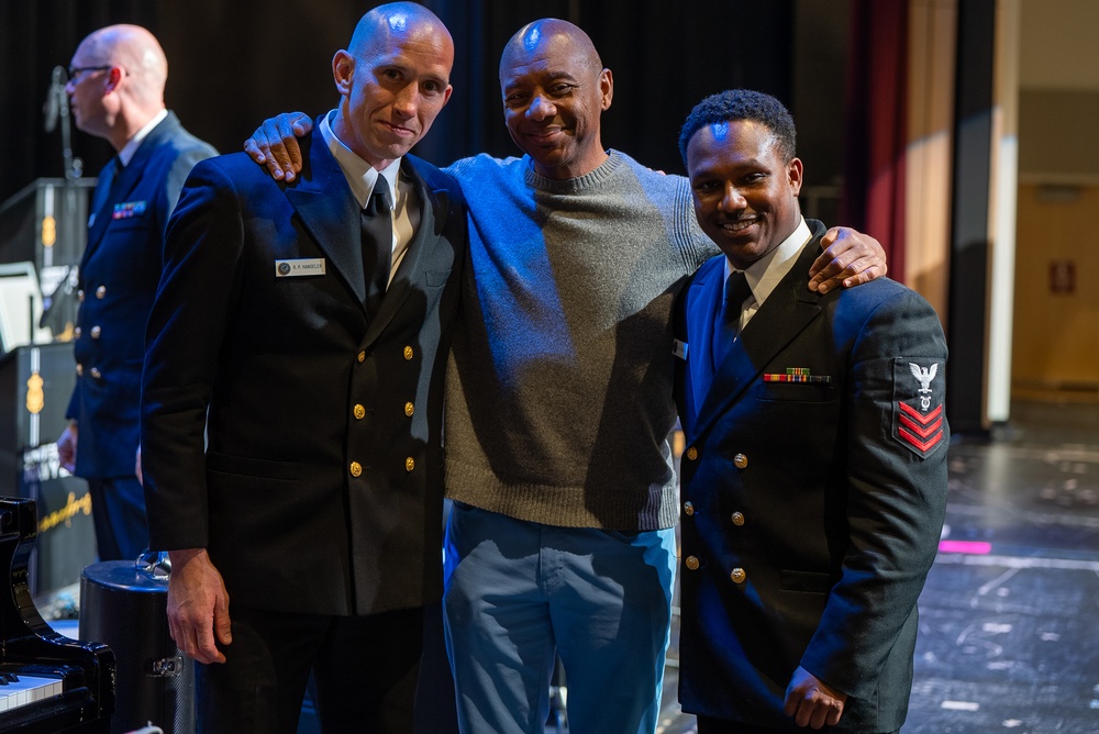 Musicians 1st Class Ryan Hanseler and William Ledbetter pose with jazz legend Branford Marsalis