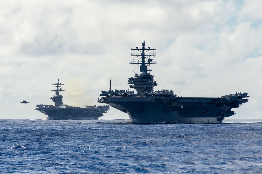 USS Carl Vinson (CVN 70) and USS Ronald Reagan (CVN 76) sail in formation during Multi-Large Deck Event (MLDE)