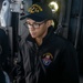 QM3 Michel operates the ship's helm in the bridge of USS Antietam (CG 54) during Multi-Large Deck Event (MLDE)