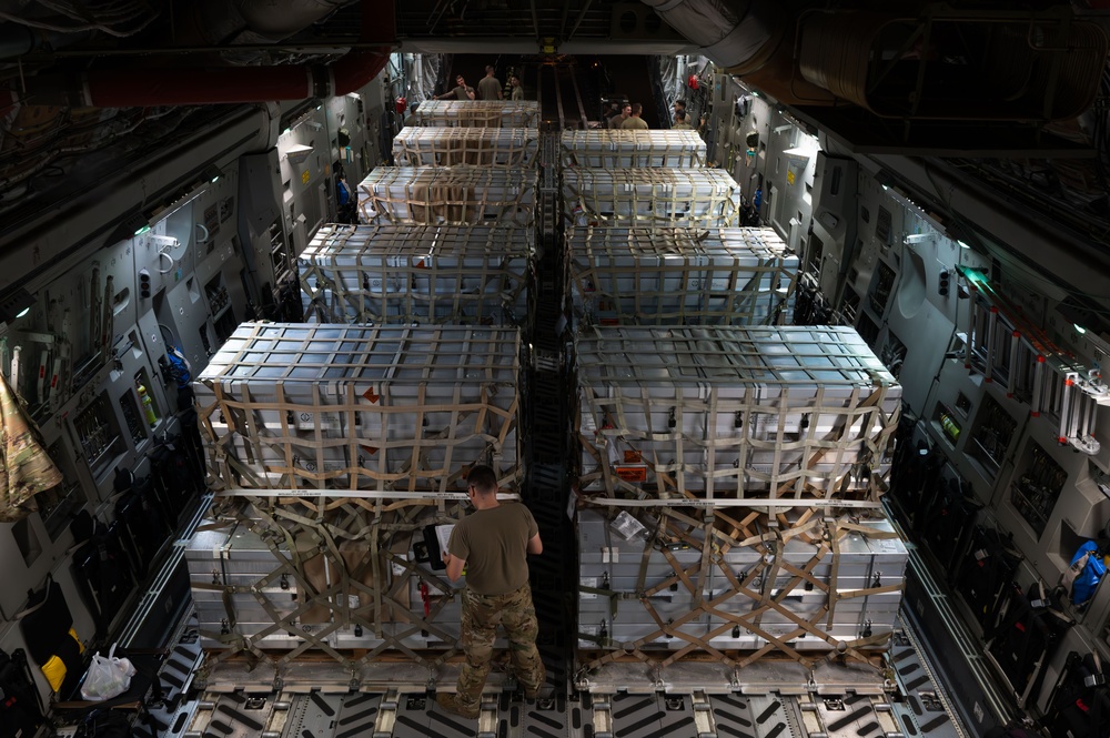 Airmen Load Cargo on C-17 Globemaster III