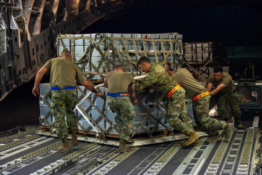 Airmen Load Cargo on C-17 Globemaster III