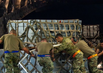 Airmen Load Cargo on C-17 Globemaster III