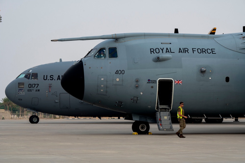 U.S. and Royal Air Forces integrate for cargo unloading, supporting Exercise Ferocious Falcon