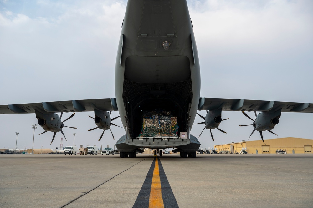 U.S. and Royal Air Forces integrate for cargo unloading, supporting Exercise Ferocious Falcon