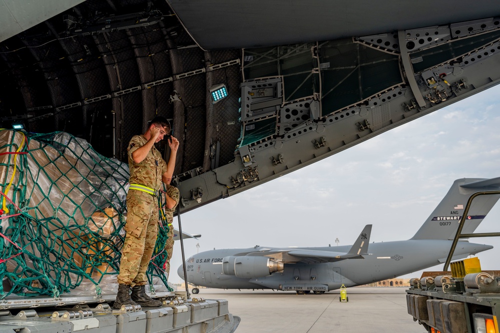 U.S. and Royal Air Forces integrate for cargo unloading, supporting Exercise Ferocious Falcon