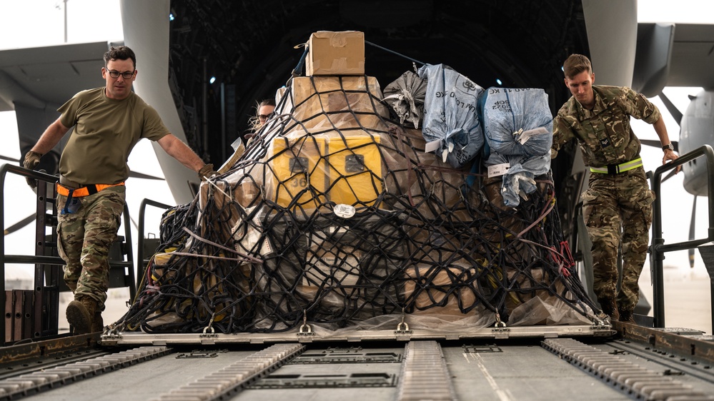 U.S. and Royal Air Forces integrate for cargo unloading, supporting Exercise Ferocious Falcon