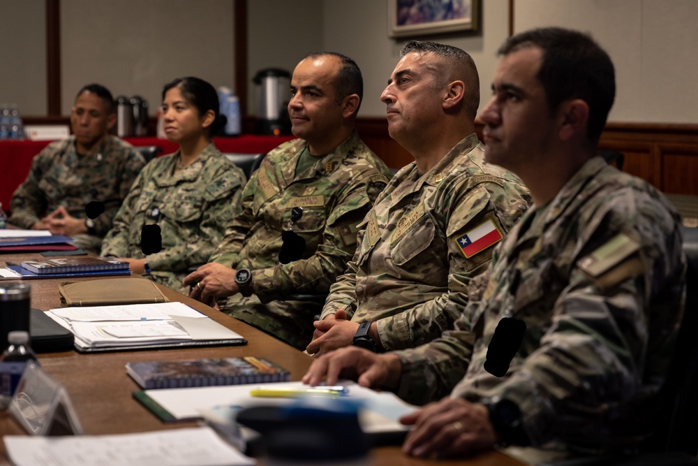 U.S. Marine Corps Lt. Gen. Bellon speaks with U.S. and Chilean Marines during a staff planner working group