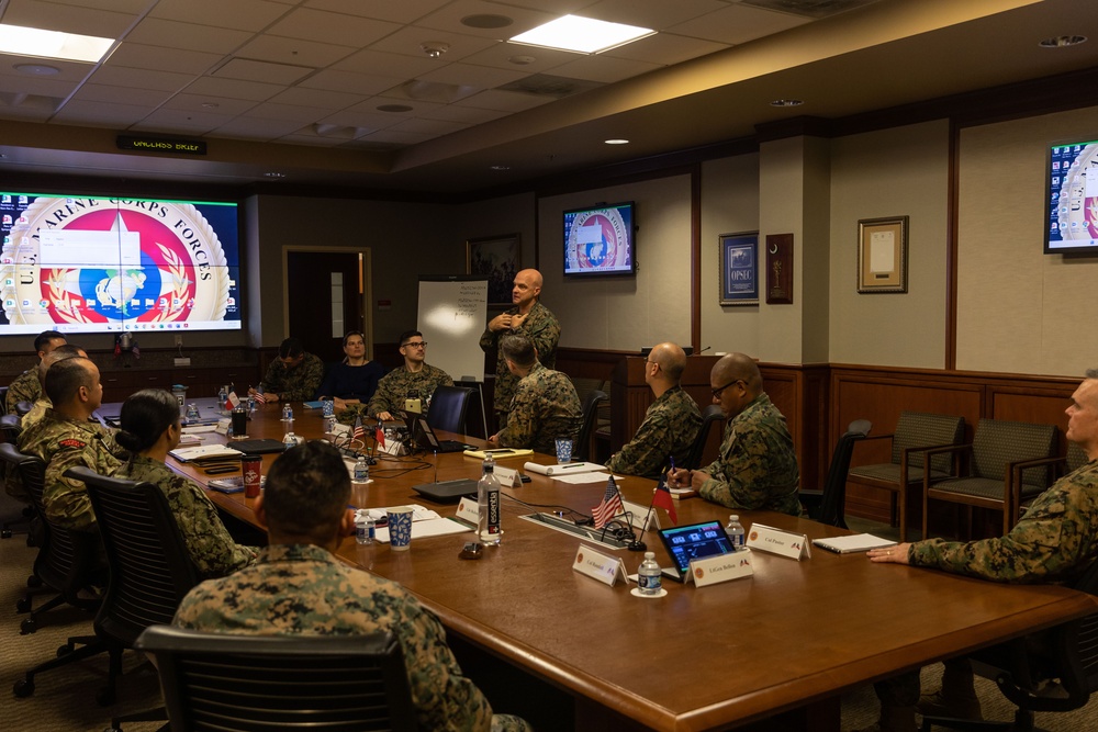 U.S. Marine Corps Lt. Gen. Bellon speaks with U.S. and Chilean Marines during a staff planner working group