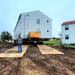 Contractors ‘drive’ World War II-era barracks buildings to new foundations at Fort McCoy