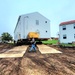 Contractors ‘drive’ World War II-era barracks buildings to new foundations at Fort McCoy