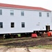 Contractors ‘drive’ World War II-era barracks buildings to new foundations at Fort McCoy