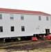 Contractors ‘drive’ World War II-era barracks buildings to new foundations at Fort McCoy