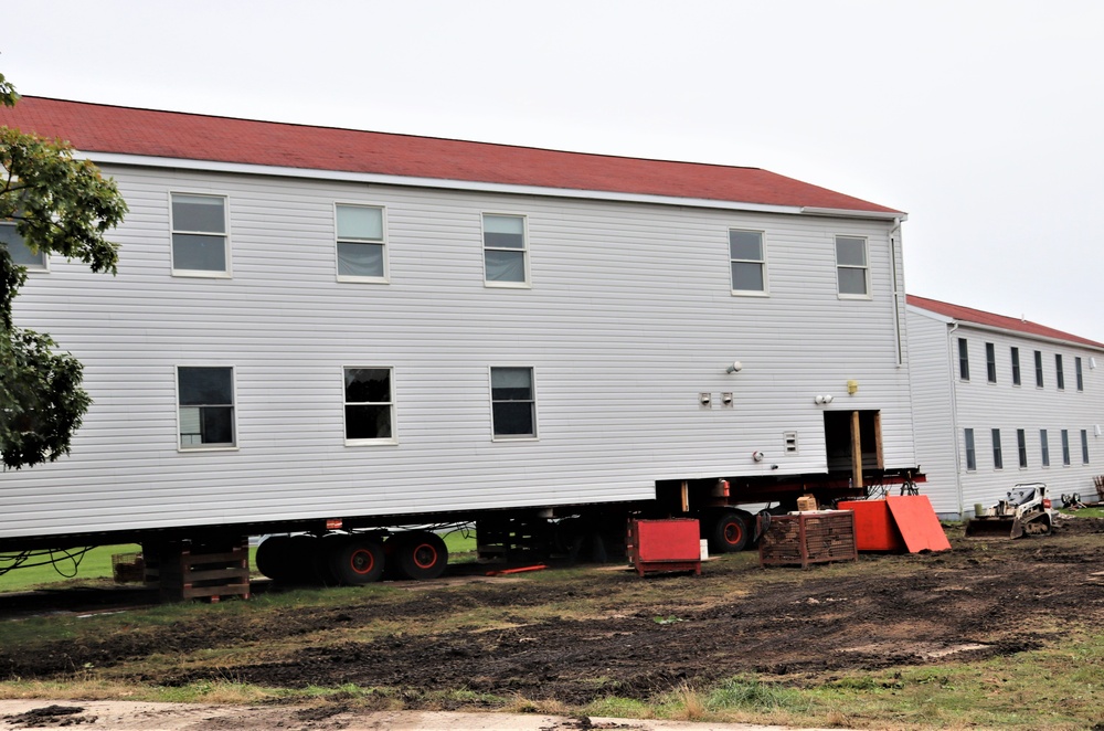 Contractors ‘drive’ World War II-era barracks buildings to new foundations at Fort McCoy