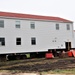 Contractors ‘drive’ World War II-era barracks buildings to new foundations at Fort McCoy