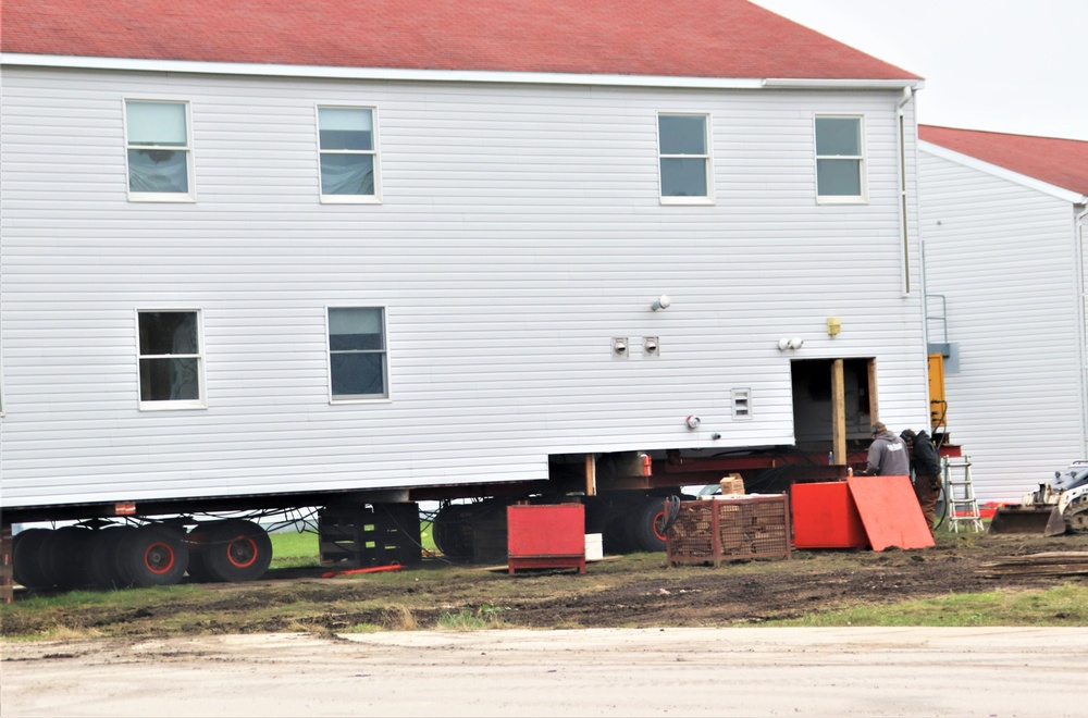 Contractors ‘drive’ World War II-era barracks buildings to new foundations at Fort McCoy