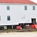 Contractors ‘drive’ World War II-era barracks buildings to new foundations at Fort McCoy