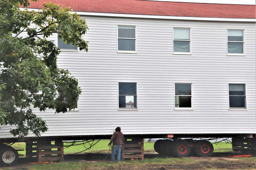 Contractors ‘drive’ World War II-era barracks buildings to new foundations at Fort McCoy