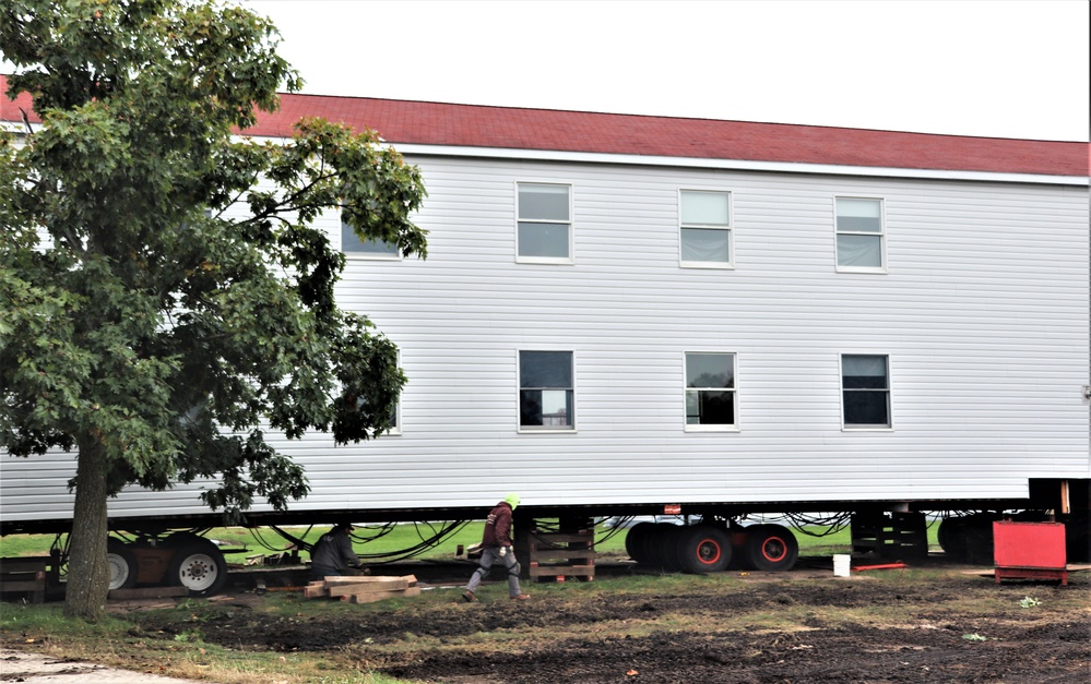 Contractors ‘drive’ World War II-era barracks buildings to new foundations at Fort McCoy