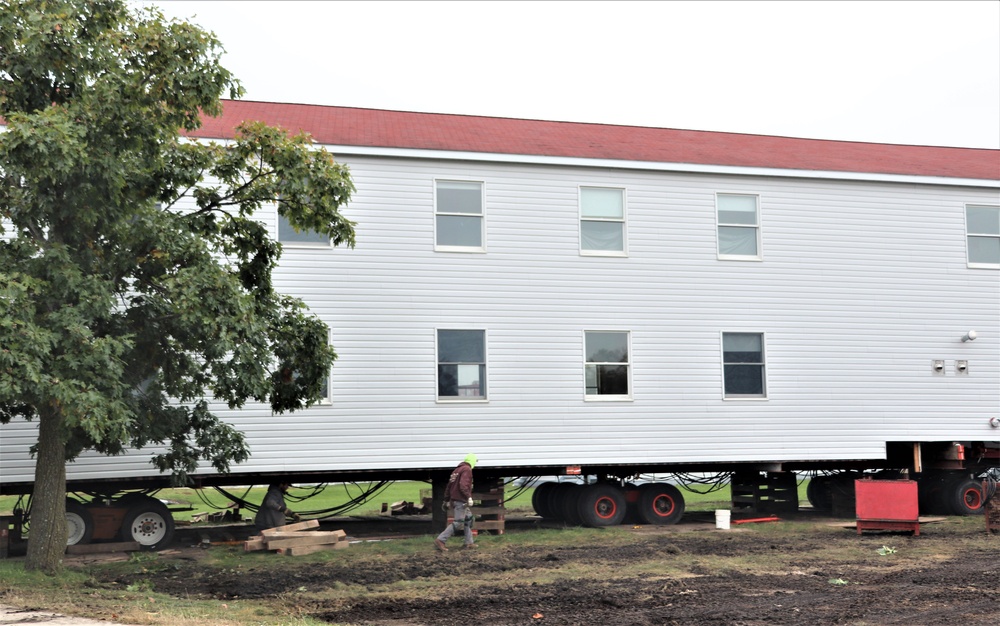 Contractors ‘drive’ World War II-era barracks buildings to new foundations at Fort McCoy