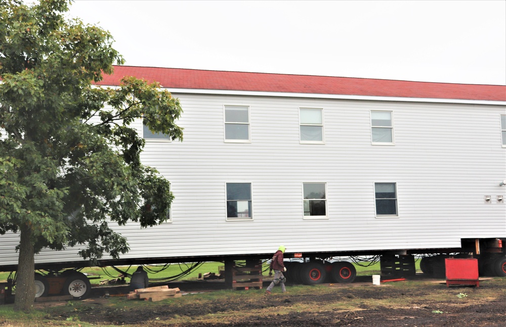 Contractors ‘drive’ World War II-era barracks buildings to new foundations at Fort McCoy