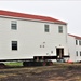 Contractors ‘drive’ World War II-era barracks buildings to new foundations at Fort McCoy