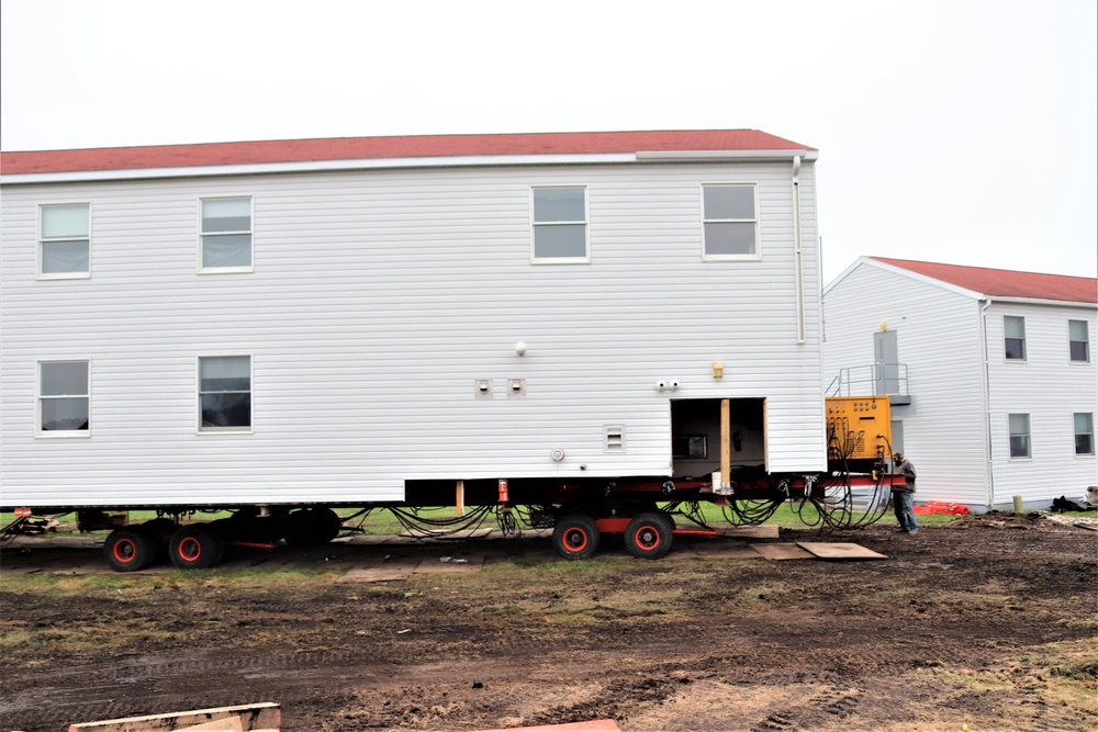 Contractors ‘drive’ World War II-era barracks buildings to new foundations at Fort McCoy