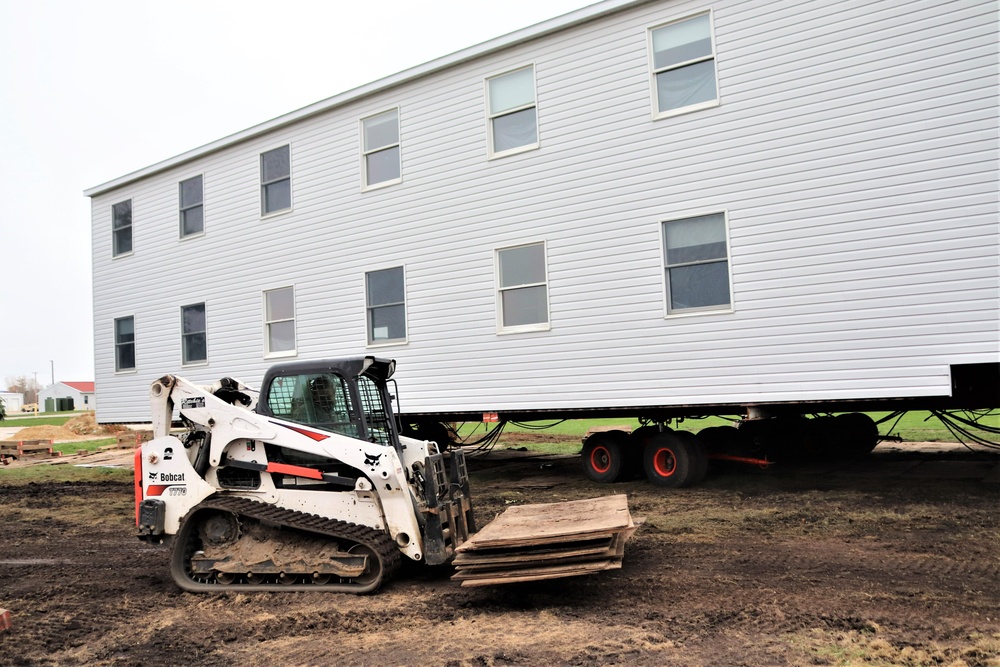 Contractors ‘drive’ World War II-era barracks buildings to new foundations at Fort McCoy