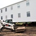 Contractors ‘drive’ World War II-era barracks buildings to new foundations at Fort McCoy